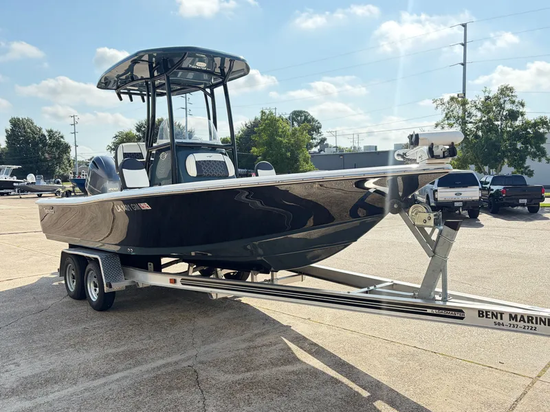 Slide: The Image of A black 2021 Tidewater 2210 Carolina Bay boat on a trailer, ready for transport. - 3