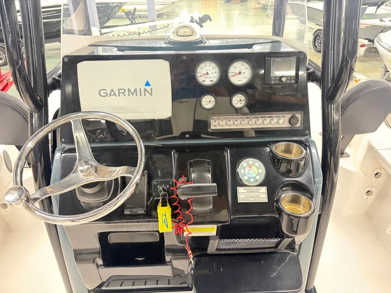 Slide: The Image of The dashboard of a 2021 Tidewater 2210 Carolina Bay with Garmin navigation and multiple gauges. - 8