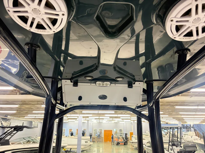 Slide: The Image of The image shows the roof of a 2021 Tidewater 2210 Carolina Bay boat with speakers and lighting. - 9