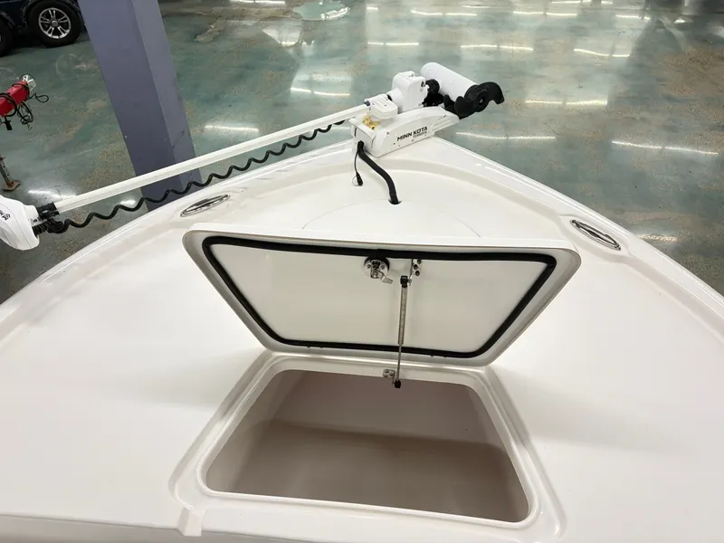 Slide: The Image of An open storage compartment on the deck of a 2021 Tidewater 2210 Carolina Bay boat. - 12