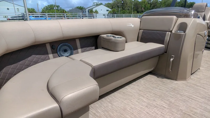 Slide: The Image of The image shows the luxurious interior of a 2022 Bennington 22 LSB with comfortable seating. - 12