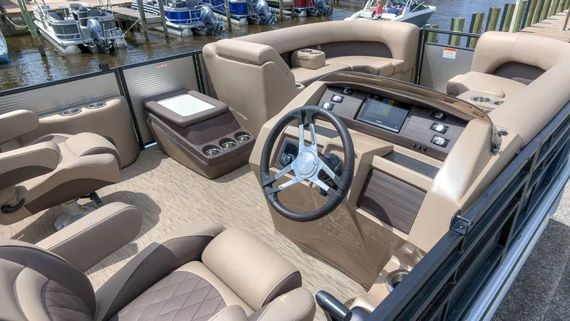 Slide: The Image of The image shows the cockpit of a 2022 Bennington 22 LSB with luxurious seating and a modern helm. - 13