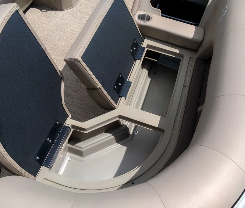 Slide: The Image of The 2022 Bennington 22 LSB features open bench storage compartments with cushioned seating. - 9