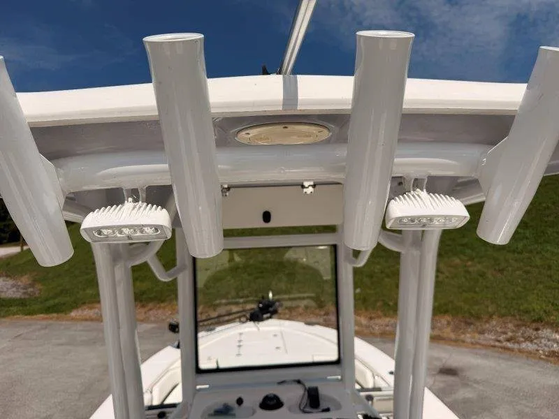 Slide: The Image of 2023 Robalo 246 Cayman with T-top and rod holders, perfect for fishing trips. - 23