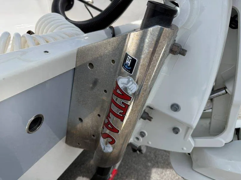 Slide: The Image of Close-up of a boat part with an Atlas sticker and a hose in the background. - 33