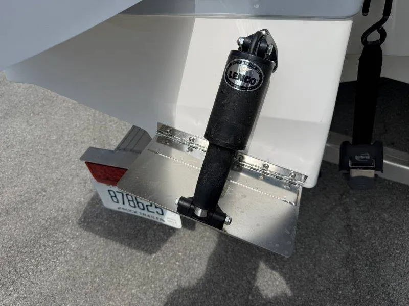 Slide: The Image of Close-up of a Lenco trim tab system on a boat. - 17