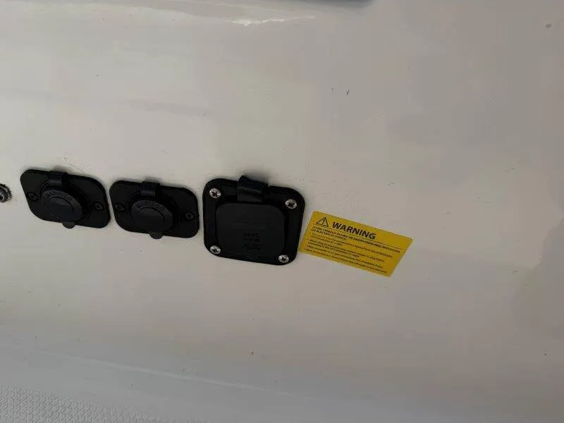 Slide: The Image of Close-up of outlets and a warning label on a boat. - 36