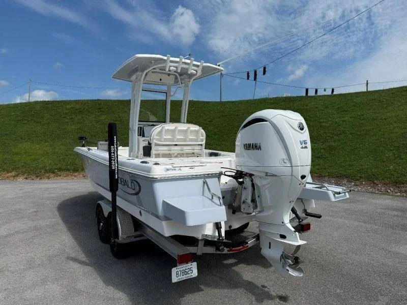 Slide: The Image of A 2023 Robalo 246 Cayman with a Yamaha V6 outboard motor on a trailer. - 10