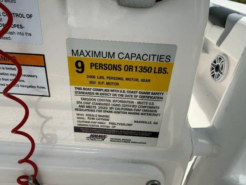 Slide: The Image of Sign shows maximum capacity of 9 persons or 1350 pounds for a Robalo 246 Cayman boat. - 42