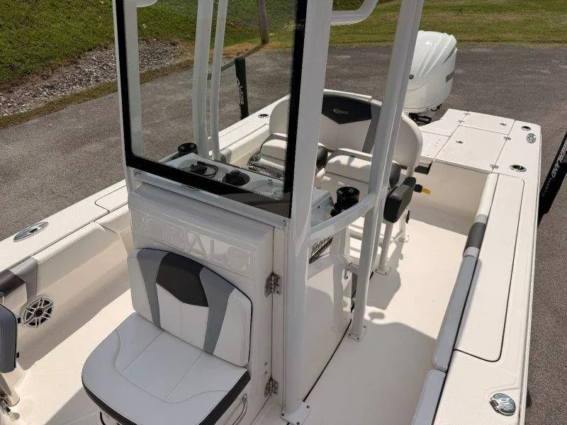 Slide: The Image of The image shows a 2023 Robalo 246 Cayman boat with white and gray interior. - 12