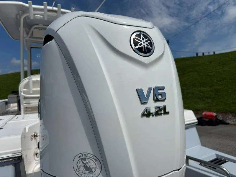 Slide: The Image of Close-up of a V6 4.2L outboard motor on a Robalo 246 Cayman boat. - 24