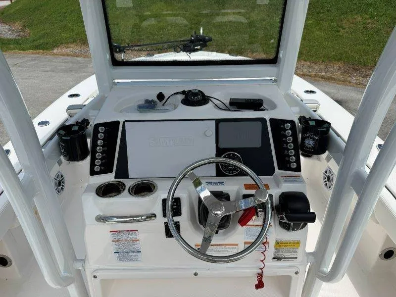 Slide: The Image of Dashboard of a 2023 Robalo 246 Cayman with steering wheel and electronic displays. - 44
