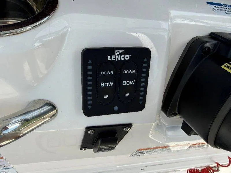 Slide: The Image of Lenco control panel on a 2023 Robalo 246 Cayman boat. - 49
