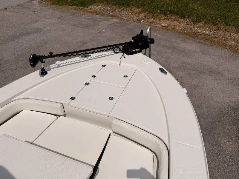 Slide: The Image of The image shows the bow of a 2023 Robalo 246 Cayman with a mounted trolling motor. - 50