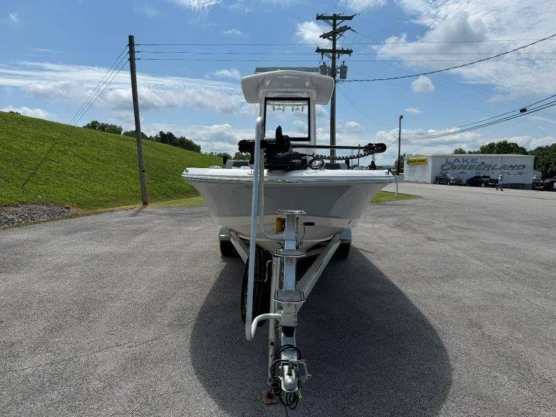 Slide: The Image of A 2023 Robalo 246 Cayman boat on a trailer, ready for transport. - 9
