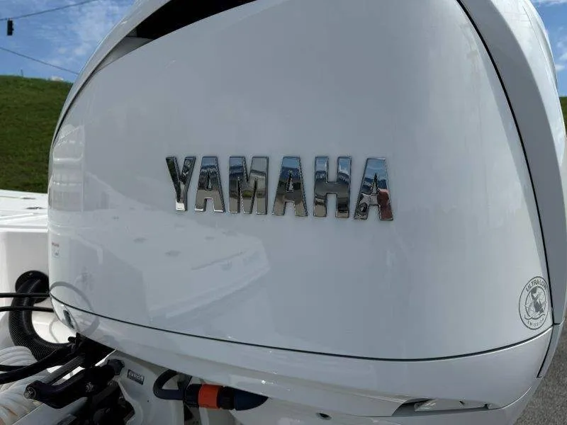 Slide: The Image of Close-up of a Yamaha outboard motor on a Robalo 246 Cayman boat. - 19