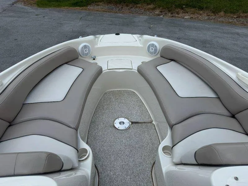 Slide: The Image of The image shows the bow of a Sea Ray 240 Sundeck boat with cushioned seating. - 42
