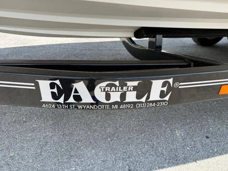 Slide: The Image of Close-up of a boat trailer labeled "Eagle Trailer" with an address in Michigan. - 14