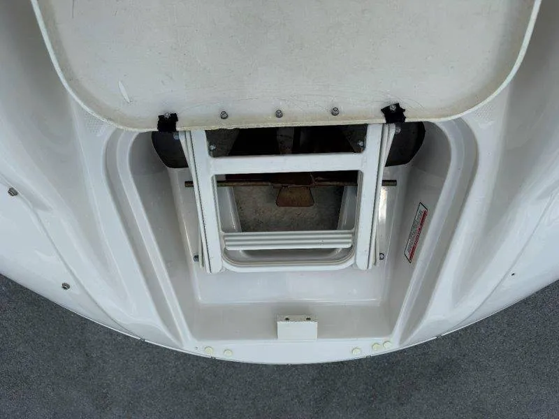 Slide: The Image of A folded swim ladder on a white boat. - 46
