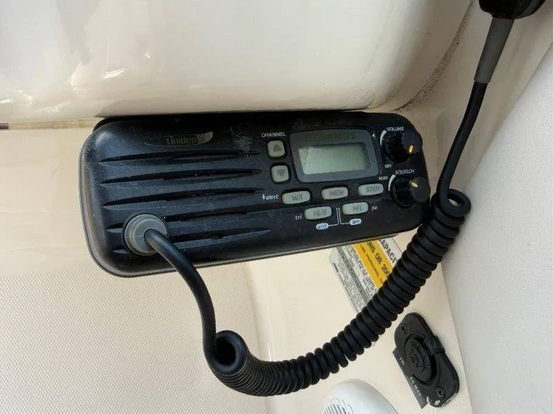 Slide: The Image of A radio is mounted in a boat, featuring a handset and a display. - 31