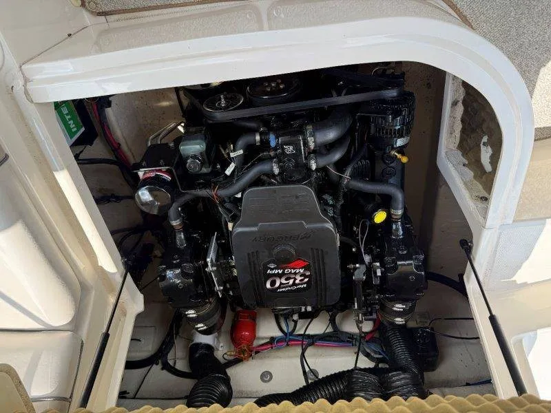 Slide: The Image of The engine compartment of a 2003 Sea Ray 240 Sundeck with a 240 HP engine. - 23