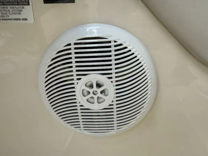 Slide: The Image of A white speaker is mounted on the wall of a boat. - 16