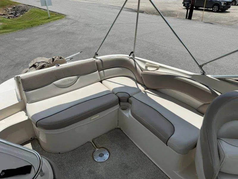 Slide: The Image of The image shows the cockpit of a 2003 Sea Ray 240 Sundeck with beige upholstery. - 47