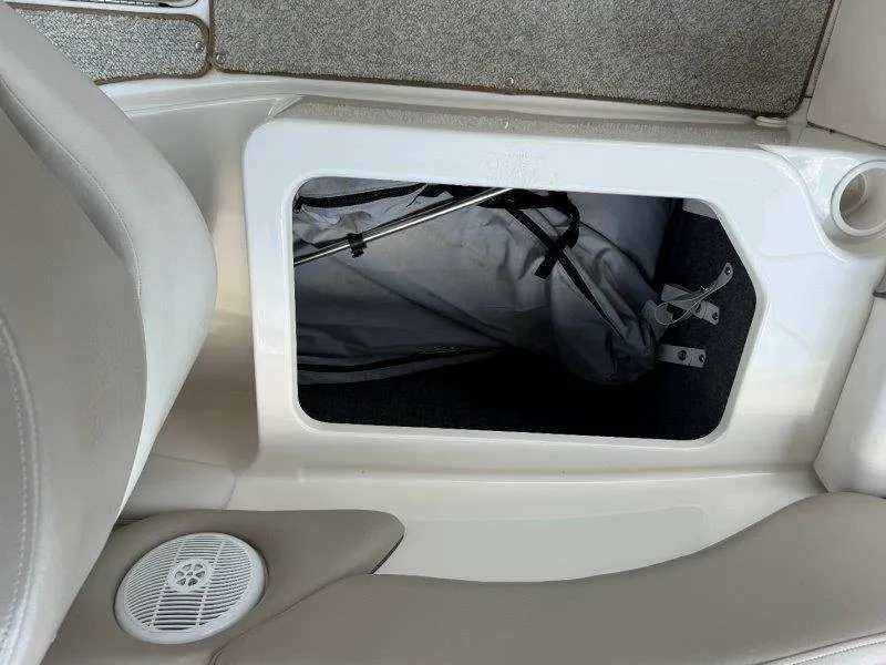 Slide: The Image of A storage compartment in the floor of a 2003 Sea Ray 240 Sundeck boat with an anchor. - 18