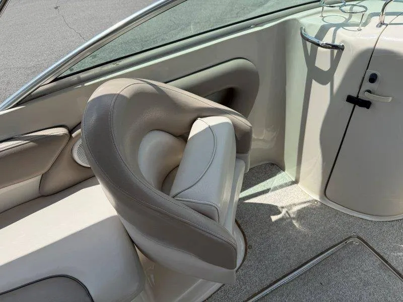 Slide: The Image of A sleek seating area on a 2003 Sea Ray 240 Sundeck boat. - 39