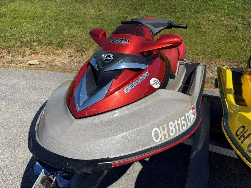 Slide: The Image of A red Sea-Doo jet ski is on a trailer on a paved area. - 10