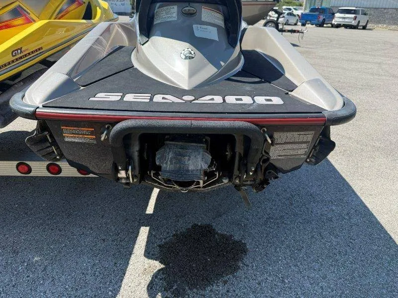 Slide: The Image of Rear view of a Sea-Doo jet ski on a trailer, featuring a gray and black design. - 22