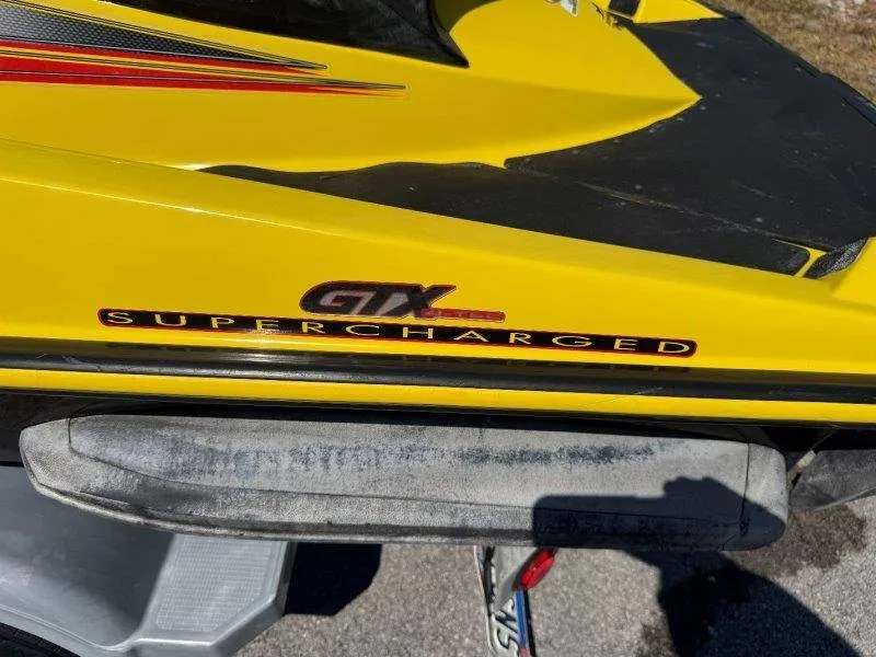 Slide: The Image of Close-up of a yellow Sea-Doo GTX SC jet ski with supercharged logo. - 18