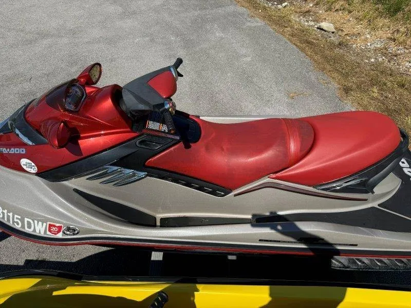 Slide: The Image of A red Sea-Doo jet ski is on a trailer on a road. - 14