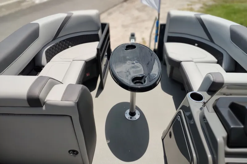 Slide: The Image of Interior of 2027 Sylvan X1 ULZ boat with sleek seating and central table. - 7