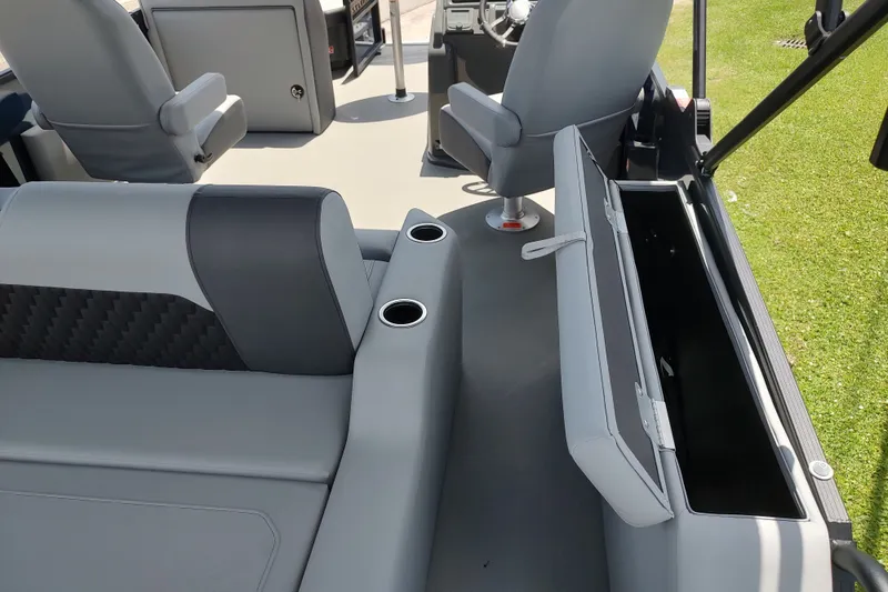 Slide: The Image of Interior of 2027 Sylvan X1 ULZ boat with gray seating and storage compartment. - 12