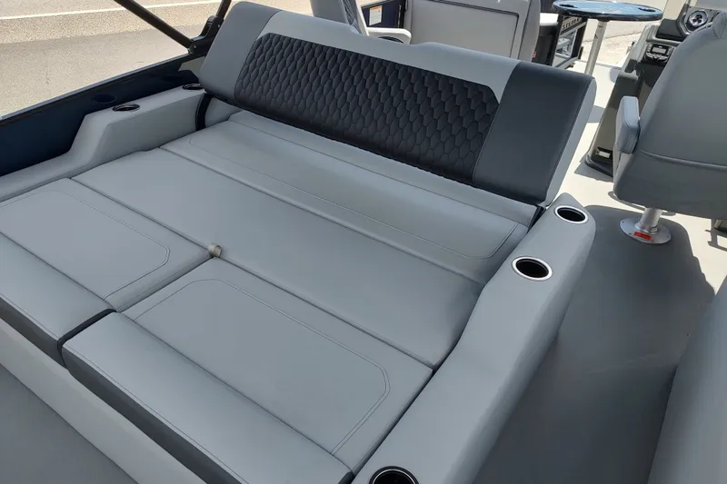 Slide: The Image of Luxurious seating area in 2027 Sylvan X1 ULZ boat with cup holders and modern design. - 9