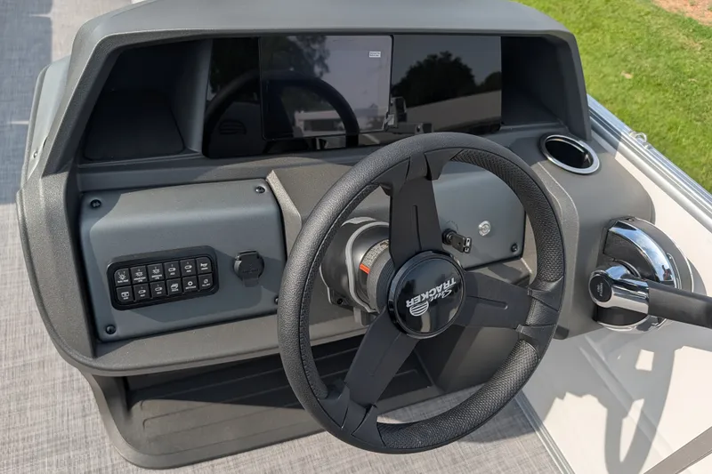 Slide: The Image of Steering console of 2027 Sun Tracker Party Barge 18 DLX with modern controls. - 18