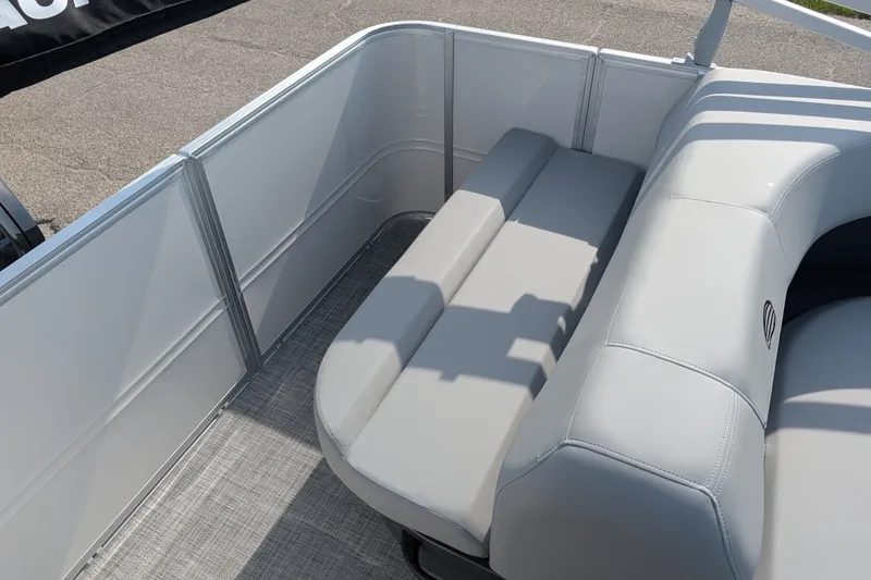 Slide: The Image of 2027 Sun Tracker Party Barge 18 DLX interior with gray seating and flooring. - 13