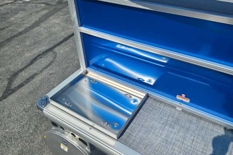 Slide: The Image of Sun Tracker Party Barge 16 DLX 2027, featuring sleek blue and silver detailing. - 21