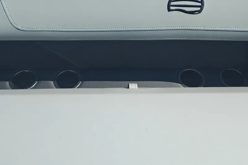 Slide: The Image of Interior of 2027 Sun Tracker Party Barge 16 DLX with cup holders and seating. - 16