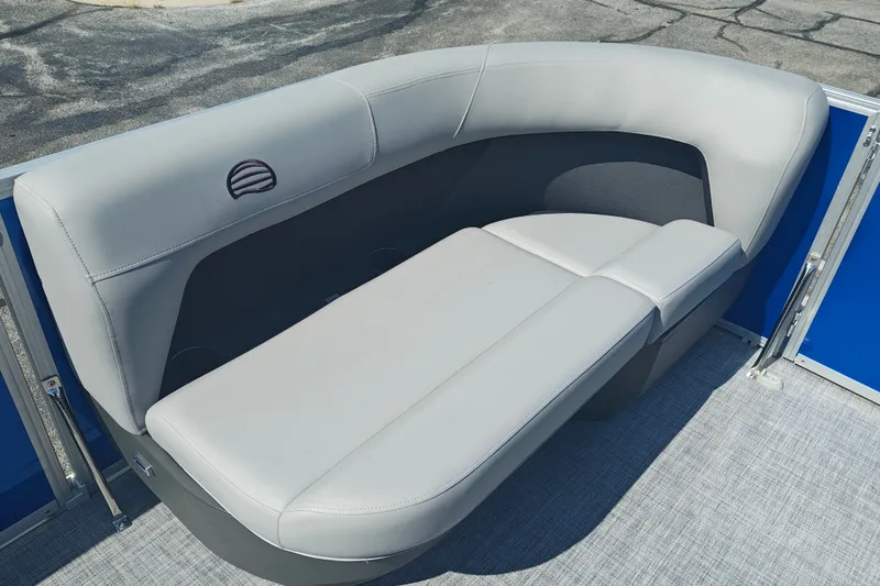 Slide: The Image of 2027 Sun Tracker Party Barge 16 DLX with comfortable gray seating and blue accents. - 17