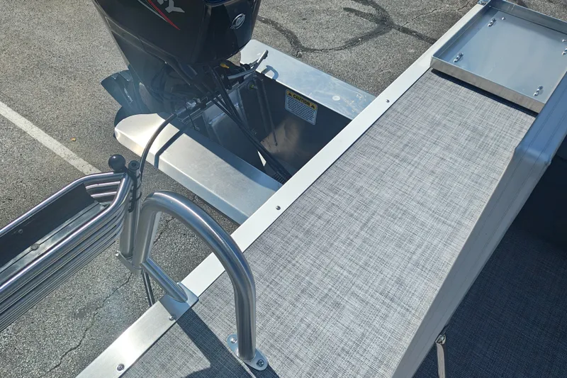 Slide: The Image of 2027 Sun Tracker Party Barge 16 DLX pontoon boat with motor and ladder detail. - 22
