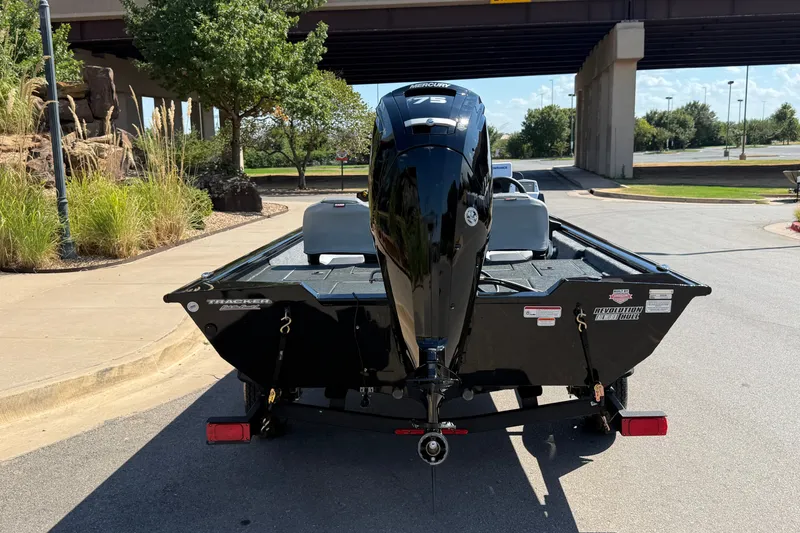 Slide: The Image of 2027 Tracker Pro Team 175 Crappie Edition boat with Mercury 75 engine, parked outdoors. - 14