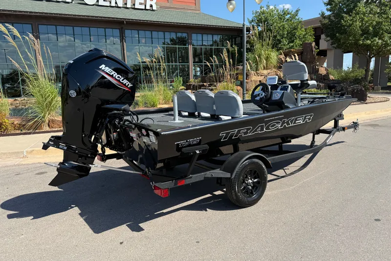 Slide: The Image of 2027 Tracker Pro Team 175 Crappie Edition boat with Mercury engine, parked outdoors. - 13