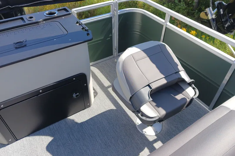 Slide: The Image of Sun Tracker Fishin' Barge 20 DLX 2027 interior with seating and console. - 18