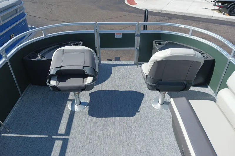 Slide: The Image of 2027 Sun Tracker Fishin' Barge 20 DLX boat interior with swivel seats and railing. - 19