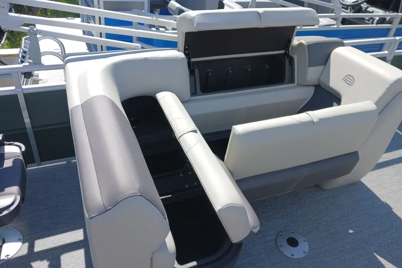 Slide: The Image of 2027 Sun Tracker Fishin' Barge 20 DLX boat seating with storage compartment open. - 17