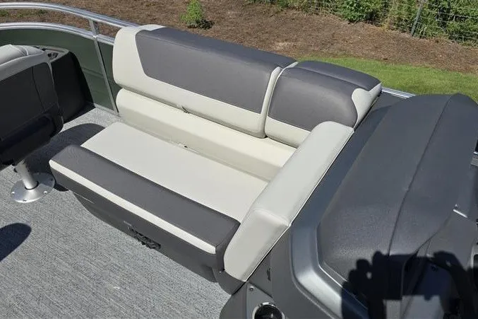 Slide: The Image of 2027 Sun Tracker Fishin' Barge 20 DLX boat seating with gray and cream upholstery. - 14
