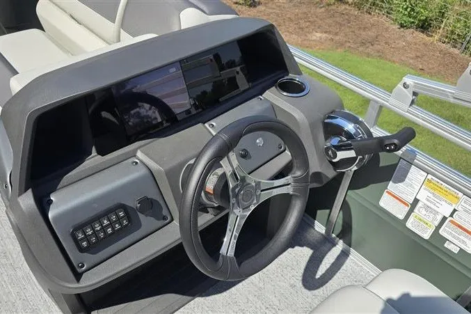 Slide: The Image of Steering console of 2027 Sun Tracker Fishin' Barge 20 DLX pontoon boat. - 13