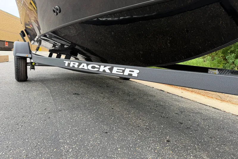 Slide: The Image of 2027 Tracker Pro Guide V-16 SC boat on trailer, close-up view. - 24